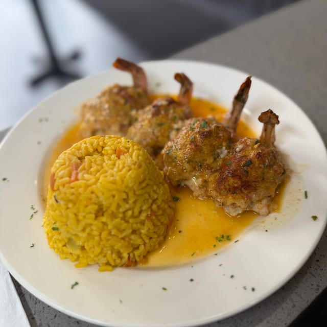 Stuffed Shrimp with Crabmeat Over Rice.