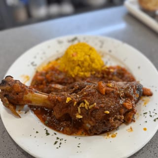 Lamb Shank Over Rice